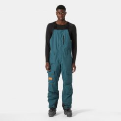 Spodnie narciarskie z szelkami i kieszenią cargo Helly Hansen Sogn. Zielone spodnie snowboardowe męskie Helly Hansen, m, bez wzorów, narciarskie. Za 1,037.00 zł.