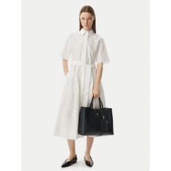 Torebka Tommy Hilfiger. Czarne torebki do ręki damskie Tommy Hilfiger, bez wzorów, klasyczne, bez dodatków. Za 699.99 zł.