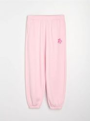 Spodnie jogger z kwiatowym nadrukiem - różowy. Czerwone spodnie materiałowe damskie Sinsay, l, bez wzorów. Za 39.99 zł.