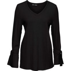 Sweter dzianinowy z rozkloszowanymi rękawami bonprix czarny. Swetry damskie marki KALENJI. Za 79.99 zł.