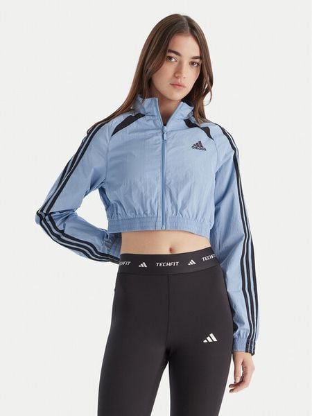 Adidas Bluza Teamgeist adicolor JZ8277 Błękitny Slim Fit. Niebieskie bluzy damskie Adidas, m, bez wzorów, z syntetyku, bez kaptura. Za 189.99 zł.