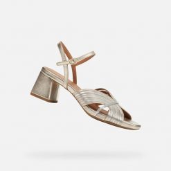 Sandały GEOX D GENZIANA MID Złoty. Szare sandały damskie Geox, bez wzorów, ze skóry, bez obcasa, bez zapięcia. Za 471.99 zł.