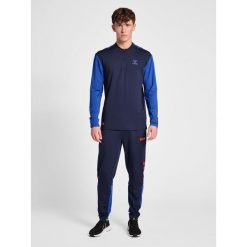 Jogging Hummel Pro Grid GK. Niebieskie krótkie spodenki sportowe męskie Hummel, l, bez wzorów, do biegania. Za 246.95 zł.