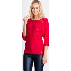 Malinowy sweter nietoperz z cekinami QUIOSQUE. Różowe swetry damskie QUIOSQUE, ze splotem, z okrągłym kołnierzem. W wyprzedaży za 96.00 zł.
