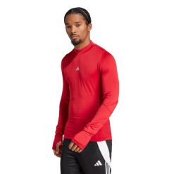 Bielizna Koszulki Adidas Sport Tf Cr Ls Tee M Dorośli. Czerwona koszulki sportowe męskie Adidas, na zimę, l, bez wzorów, z elastanu, bez kołnierzyka, bez ramiączek, na fitness i siłownię. Za 220.35 zł.
