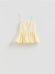 Bluzka z baskinką - jasnożółty. Żółte bluzki damskie Reserved, l, bez wzorów, z bawełny, klasyczne, bez kołnierzyka, bez ramiączek. Za 139.99 zł.