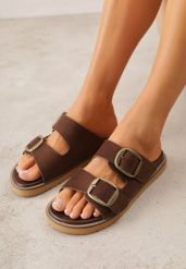 Brązowe Klapki VICES Ozdobione Dużymi Klamrami Jenniviane. Brązowe klapki damskie Renee, bez wzorów, z jeansu, eleganckie, bez obcasa, na płaskiej podeszwie. Za 99.99 zł.