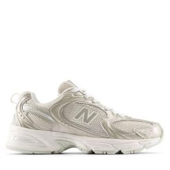 Damskie tenisówki New Balance. Żółte trampki i tenisówki damskie New Balance, bez wzorów, z materiału, eleganckie, bez zapięcia. Za 530.40 zł.