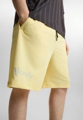 Spodenki sportowe męskie Prosto Nine. Żółte krótkie spodenki sportowe męskie Prosto., m, z aplikacjami, z elastanu. Za 224.99 zł.