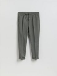 Spodnie regular z włóknem bambusowym - zielony. Zielone spodnie materiałowe męskie Reserved, l, bez wzorów, z dzianiny. Za 129.99 zł.