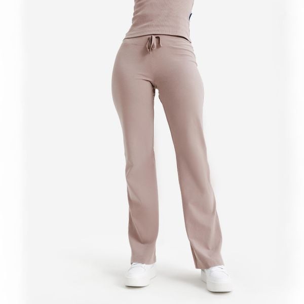 Rozszerzane legginsy damskie Elementals. Brązowe legginsy damskie Decathlon, l, bez wzorów, z bawełny. Za 49.99 zł.
