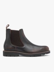 Ciemnobrązowe skórzane sztyblety. Brązowe botki męskie Ryłko, bez wzorów, ze skóry, eleganckie, przed kolano, bez zapięcia. Za 629.99 zł.