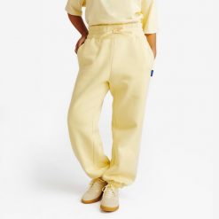 Spodnie dresowe damskie Elementals. Żółte spodnie dresowe damskie Decathlon, s, bez wzorów, z bawełny. Za 159.99 zł.