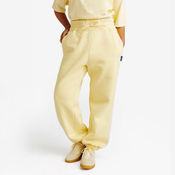 Spodnie dresowe damskie Elementals. Żółte spodnie dresowe damskie Decathlon, m, z aplikacjami, z bawełny. Za 159.99 zł.