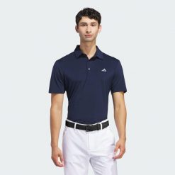 Koszulka polo Ultimate365 Solid. Niebieskie buty sportowe męskie Adidas, m, bez wzorów, z materiału, sportowe, bez ramiączek. Za 259.00 zł.