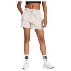 Damskie szorty tkane adidas Essentials 3-Stripes. Brązowe szorty sportowe damskie Adidas, l, bez wzorów, z materiału, sportowe, na fitness i siłownię. Za 168.00 zł.