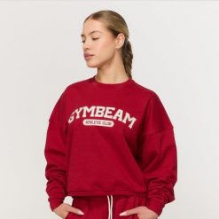 Bluza damska fitness bez kaptura czerwona Varsity. Czerwone bluzy damskie GYMBEAM, m, bez wzorów, z bawełny, bez kaptura, na fitness i siłownię. Za 139.90 zł.