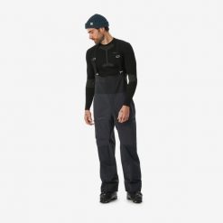 Spodnie narciarskie ogrodniczki męskie Wedze FR900. Czarne spodnie snowboardowe męskie WED'ZE, na zimę, l, bez wzorów, z materiału, narciarskie. Za 699.99 zł.