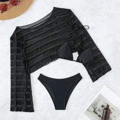 Komplet plażowy z ażurową narzutką i bikini na lato Tressa. Czarne bikini damskie Intica, na lato, l, w ażurowe wzory. W wyprzedaży za 169.00 zł.