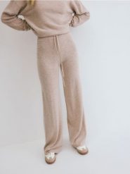 Spodnie z wiązaniem z wełny merino - beżowy. Brązowe spodnie materiałowe damskie Reserved, l, bez wzorów, z dzianiny. W wyprzedaży za 219.99 zł.