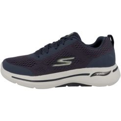 Obuwie treningowe Mężczyzna Skechers Go Walk Arch Fit granatowy. Niebieskie buty sportowe męskie Skechers, bez zapięcia, na fitness i siłownię. Za 379.00 zł.