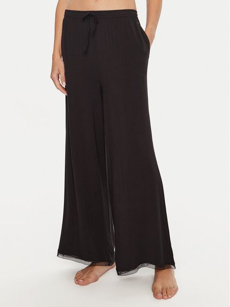 Tommy Hilfiger Spodnie piżamowe UW0UW05575 Czarny Relaxed Fit. Czarne piżamy damskie Tommy Hilfiger, xs, bez wzorów, bez ramiączek. Za 149.99 zł.