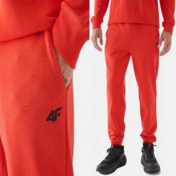 SPODNIE DRESOWE MĘSKIE 4F JOGGERY DRESY SPORTOWE POMARAŃCZOWE. Brązowe spodnie sportowe męskie 4f, l, bez wzorów, z bawełny, na fitness i siłownię. Za 149.99 zł.
