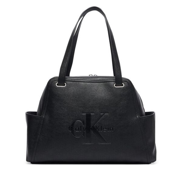 Torebka Calvin Klein. Czarne torebki do ręki damskie Calvin Klein, bez wzorów, klasyczne, bez dodatków. Za 584.99 zł.