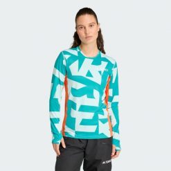 Koszulka z długim rękawem Multi Synthetic Base Layer. Brązowe koszulki sportowe damskie Adidas, s, bez wzorów, bez kołnierzyka, bez ramiączek, trekkingowe, climacool (adidas). W wyprzedaży za 142.35 zł.