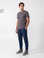 Spodnie dresowe comfort fit z domieszką bawełny - szary. Szare spodnie sportowe męskie Sinsay, l, bez wzorów, z bawełny, na fitness i siłownię. Za 39.99 zł.