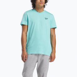 Koszulka Reebok Identity Small Logo Tee. Niebieskie koszulki sportowe męskie REEBOK FITNESS, m, bez wzorów, z materiału, bez kołnierzyka, bez ramiączek, na fitness i siłownię. Za 66.99 zł.