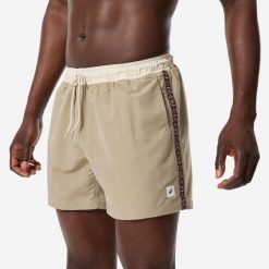 Spodenki surfingowe męskie Decathlon 100 Georetro 15". Brązowe kąpielówki męskie Decathlon, l, bez wzorów, z materiału, krótkie. Za 49.99 zł.