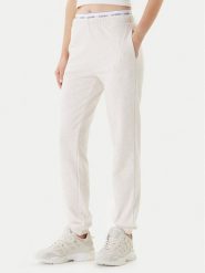 Guess Spodnie dresowe O5RB01 KCO31 Beżowy Regular Fit. Brązowe spodnie dresowe damskie Guess, xl, z aplikacjami, z bawełny. Za 209.99 zł.