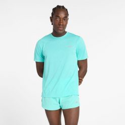 Koszulka męska New Balance MT41253CYJ – niebieska. Niebieskie koszulki sportowe męskie New Balance, m, bez wzorów, z materiału, bez kołnierzyka, bez ramiączek, na fitness i siłownię. Za 99.99 zł.