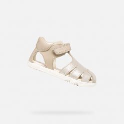 Sandały GEOX B SANDAL STEPPIEUP Złoty. Żółte sandały damskie Geox, bez wzorów, ze skóry, bez obcasa, bez zapięcia. Za 206.99 zł.