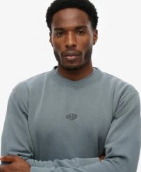 Superdry Micro Logo Crew męska bluza Loose Fit. Niebieskie bluzy męskie Superdry., m, bez wzorów, z bawełny, bez kaptura. Za 286.55 zł.