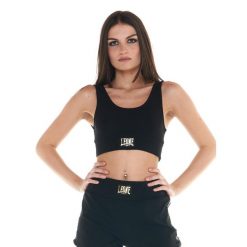 Podstawowy, krótki garnitur damski. Czarne obuwie sportowe damskie LEONE 1947 APPAREL, bez wzorów, z dresówki, na fitness i siłownię. Za 136.83 zł.