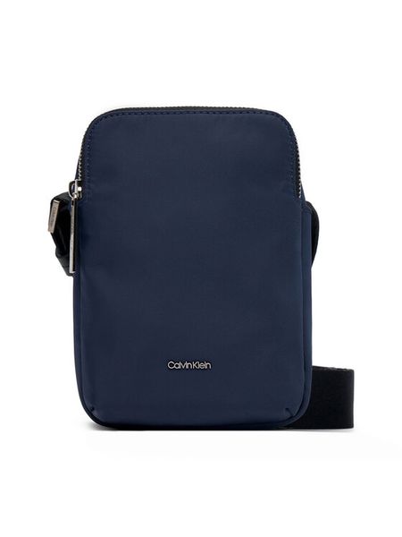 Calvin Klein Saszetka Business Tech Reporter Xs K50K512888 Granatowy. Niebieskie saszetki męskie Calvin Klein, z materiału. Za 189.99 zł.