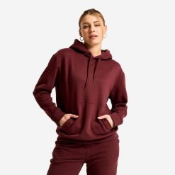 Bluza z kapturem damska Essential. Fioletowe bluzy sportowe damskie Decathlon, l, bez wzorów, z materiału, z kapturem, na fitness i siłownię. Za 89.99 zł.