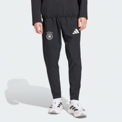 Spodnie Germany Tiro Travel. Czarne spodnie sportowe męskie Adidas, bez wzorów, z dresówki, do piłki nożnej. Za 329.00 zł.