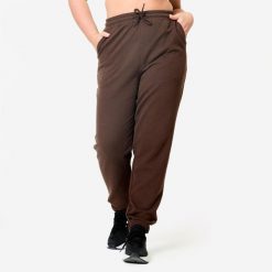 Spodnie dresowe damskie Domyos Gym & Pilates. Brązowe spodnie dresowe damskie DOMYOS, m, bez wzorów, z bawełny. Za 89.99 zł.