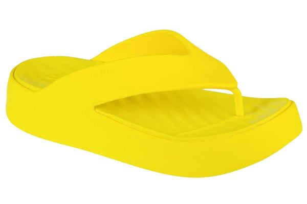 Japonki damskie Crocs C4618. Żółte klapki damskie Crocs, bez wzorów, z materiału, bez obcasa. Za 119.99 zł.