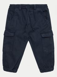 OVS Spodnie materiałowe 2099375 Niebieski Regular Fit. Niebieskie spodnie materiałowe dla chłopców OVS, bez wzorów, z bawełny. Za 59.99 zł.