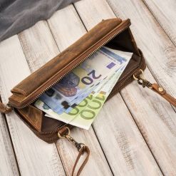 Paolo Peruzzi Skórzana kopertówka damska do ręki na ramię portfel damski T-137-HBR. Kopertówki damskie Paolo Peruzzi, bez wzorów, do ręki, bez dodatków. Za 205.41 zł.