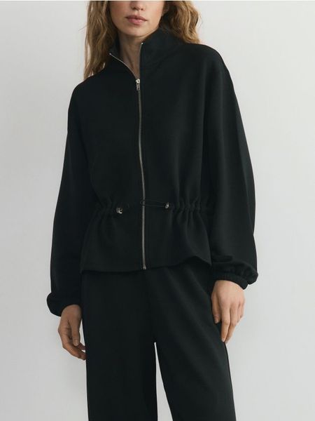 Rozpinana bluza z modalem - czarny. Czarne bluzy damskie Reserved, l, bez wzorów, z dzianiny, bez kaptura. W wyprzedaży za 99.99 zł.