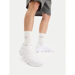 Buty do biegania Reebok. Białe buty sportowe męskie Reebok, bez zapięcia, do biegania. Za 389.99 zł.