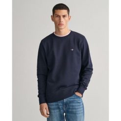 Bluza Gant Shield. Niebieskie bluzy męskie GANT, s, z aplikacjami, z bawełny, bez kaptura. Za 363.00 zł.