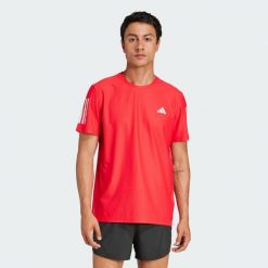 Koszulka Own The Run. Czerwone koszulki sportowe męskie Adidas, xs, bez wzorów, z materiału, bez kołnierzyka, bez ramiączek, do biegania. Za 148.95 zł.