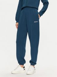 Guess Spodnie dresowe V4BB13 K7UW2 Niebieski Regular Fit. Niebieskie spodnie dresowe damskie Guess, m, z aplikacjami, z dresówki. Za 199.99 zł.