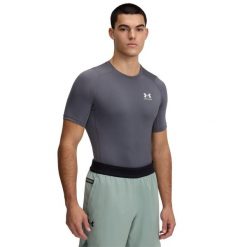 Koszulka Under Armour HeatGear. Białe koszulki sportowe męskie Under Armour, xl, bez wzorów, z materiału, bez kołnierzyka, bez ramiączek, do biegania. Za 161.70 zł.